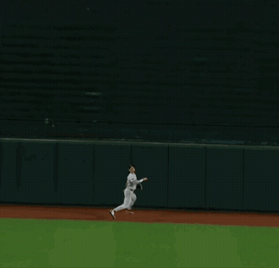 A Man Wearing A Boston Jersey Stands On The Field GIF