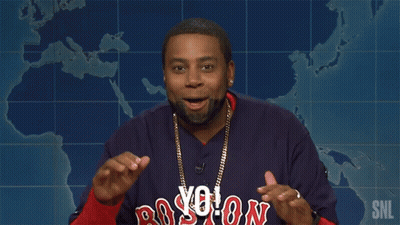 A Man Wearing A Boston Red Sox Jersey Is Giving A Speech GIF