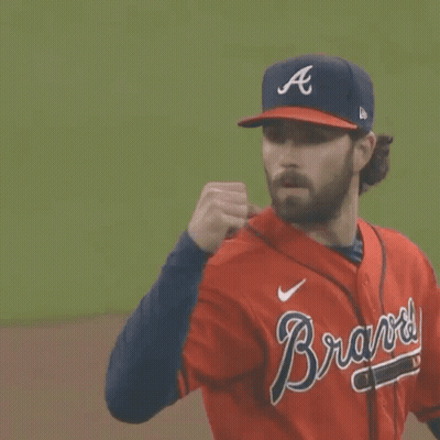 A Man Wearing A Braves Jersey And A Hat GIF