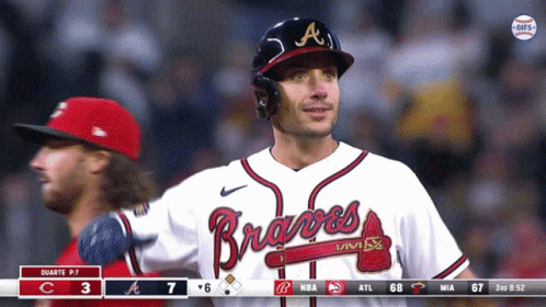 A Man Wearing A Braves Jersey Stands In The Outfield GIF