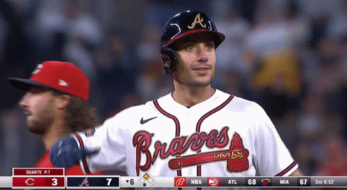 A Man Wearing A Braves Jersey Stands In The Outfield GIF