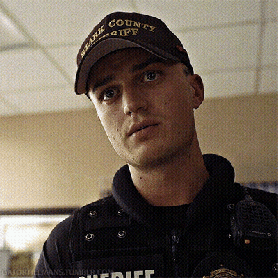 A Man Wearing A Brown Hat That Says Spark County Sheriff GIF