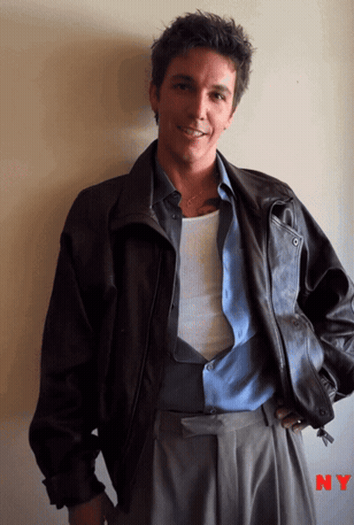 A Man Wearing A Brown Leather Jacket And A Blue Shirt With Ny Written On The Bottom GIF