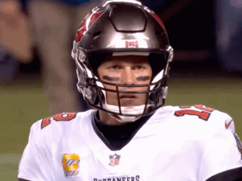 A Man Wearing A Buccaneers Helmet And Jersey GIF