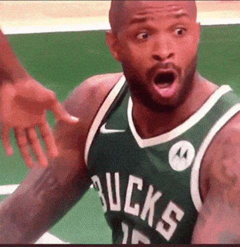 A Man Wearing A Bucks Jersey Is Making A Surprised Face GIF
