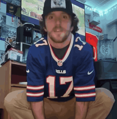A Man Wearing A Buffalo Bills Jersey And A Hat GIF
