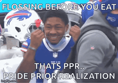 A Man Wearing A Buffalo Bills Jersey Is Flossing His Teeth GIF