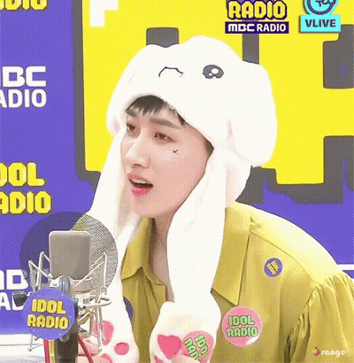 A Man Wearing A Bunny Hat With The Words Idol Radio On The Bottom GIF