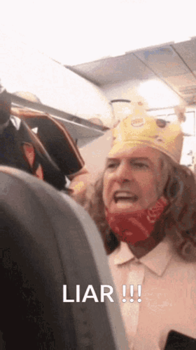 A Man Wearing A Burger King Crown Is Yelling At Another Man GIF