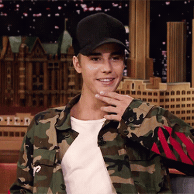 A Man Wearing A Camo Jacket And A Black Hat GIF