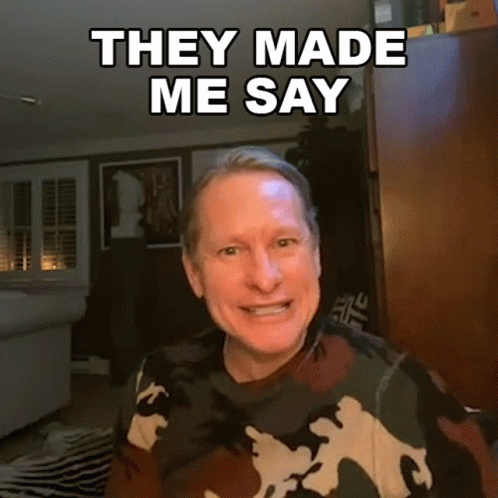 A Man Wearing A Camouflage Sweater Is Smiling And Says They Made Me Say GIF