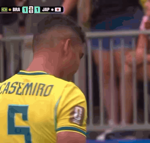 A Man Wearing A Casemiro Jersey Looks Down GIF