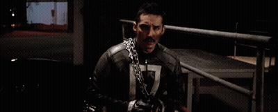 A Man Wearing A Chain Around His Neck Has The Number 7 On His Chest GIF