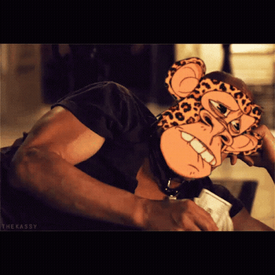 A Man Wearing A Cheetah Mask Is Holding A Cup Of Coffee GIF