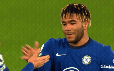A Man Wearing A Chelsea Jersey Talks To Another Player GIF
