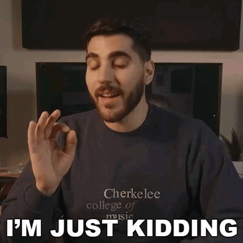 A Man Wearing A Cherkeelee College Of Music Sweatshirt Says I 'M Just Kidding GIF