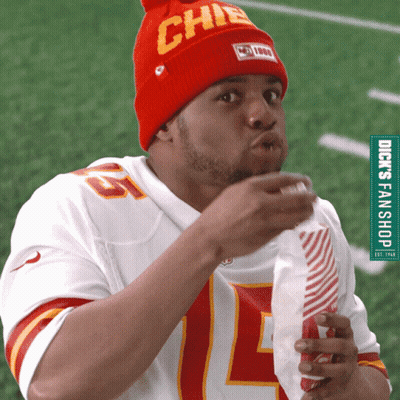 A Man Wearing A Chiefs Jersey And A Red Hat GIF