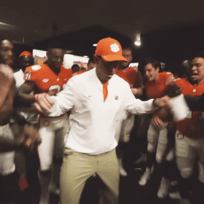 A Man Wearing A Clemson Hat Is Dancing With His Team GIF
