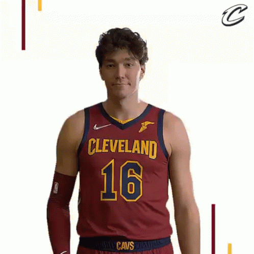 A Man Wearing A Cleveland Cavs Jersey Is Making A Funny Face . GIF