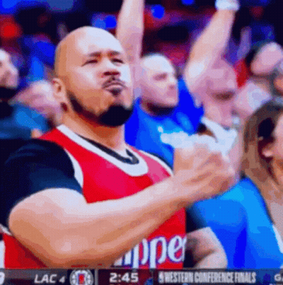 A Man Wearing A Clippers Jersey Is Giving A Thumbs Up GIF