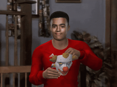 A Man Wearing A Clown Mask And A Red Chevrolet Shirt GIF