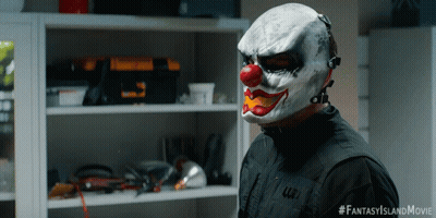 A Man Wearing A Clown Mask Has The Hashtag Fantasyislandmovie On The Bottom GIF