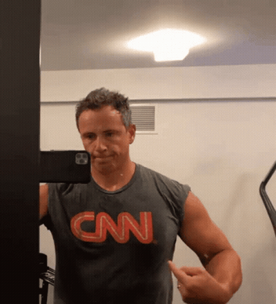 A Man Wearing A Cnn Shirt Takes A Selfie GIF