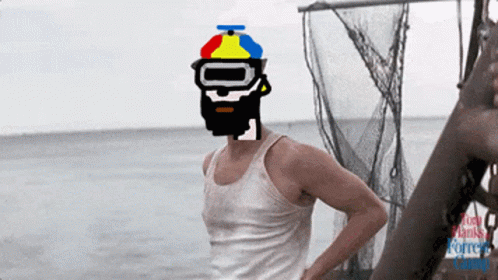 A Man Wearing A Colorful Hat And Goggles Stands On A Beach GIF