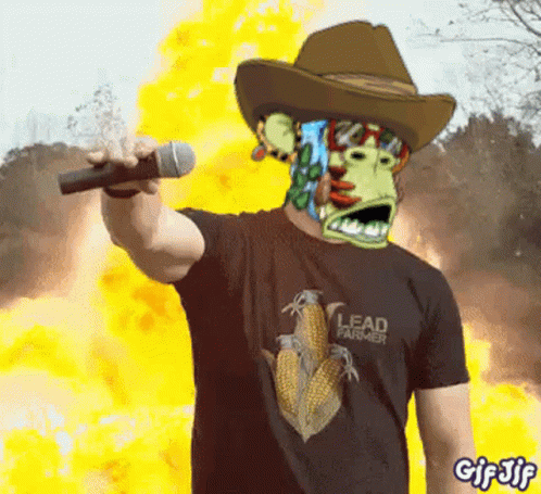 A Man Wearing A Cowboy Hat And A Lead Farmer Shirt GIF