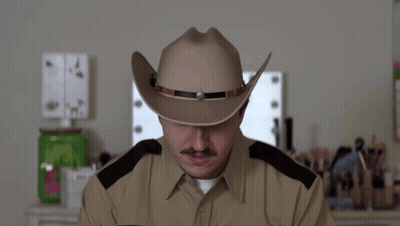 A Man Wearing A Cowboy Hat And A Police Uniform Says Thought GIF