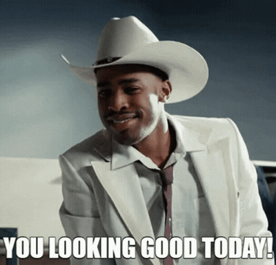 A Man Wearing A Cowboy Hat And A White Suit Says " You Looking Good Today " GIF