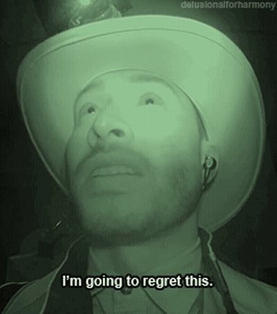 A Man Wearing A Cowboy Hat And Ear Buds Says I 'M Going To Regret This GIF