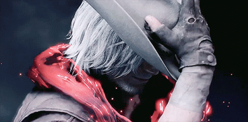 A Man Wearing A Cowboy Hat And Gloves GIF