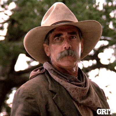 A Man Wearing A Cowboy Hat And Scarf With The Word Grit On The Bottom Right GIF