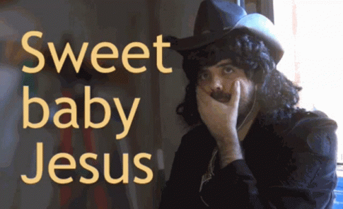 A Man Wearing A Cowboy Hat Covering His Mouth With His Hand And The Words Sweet Baby Jesus Written Above Him GIF