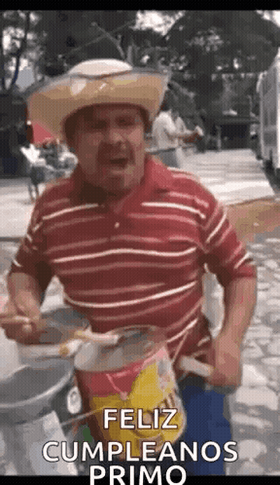 A Man Wearing A Cowboy Hat Is Playing A Drum And Singing . GIF