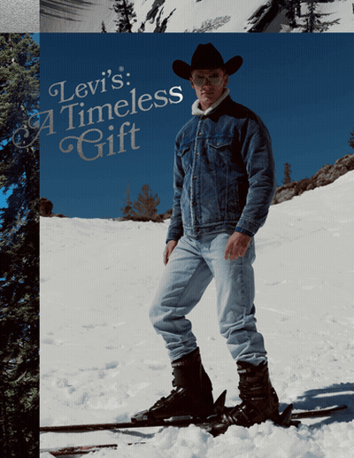 A Man Wearing A Cowboy Hat Is Standing On Skis In The Snow With The Words Levi 'S Timeless Gift Behind Him GIF