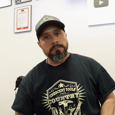 A Man Wearing A Crescent Tools Country Shirt GIF