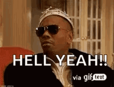 A Man Wearing A Crown And Sunglasses Is Sitting In A Chair And Saying Hell Yeah . GIF