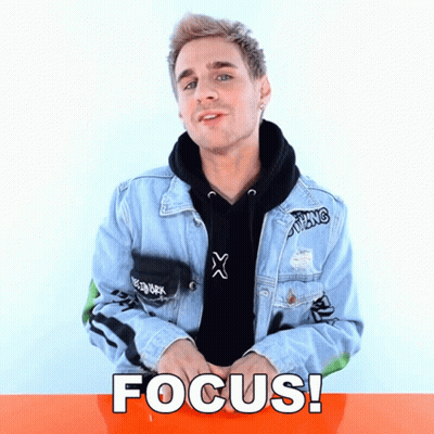 A Man Wearing A Denim Jacket And A Black Hoodie With The Word Focus Written On It GIF