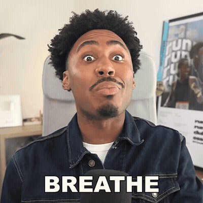 A Man Wearing A Denim Jacket Says Breathe GIF