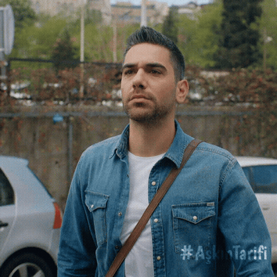 A Man Wearing A Denim Shirt That Says #Ask Tarifi GIF