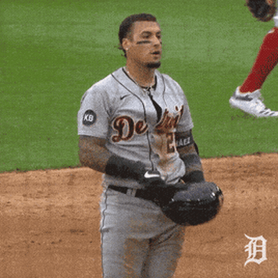 A Man Wearing A Detroit Jersey Holds His Hand To His Mouth GIF