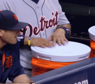 A Man Wearing A Detroit Jersey Looks At A White Bucket GIF