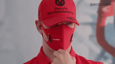 A Man Wearing A Deutsche Vermögensberatung Hat And A Face Mask GIF