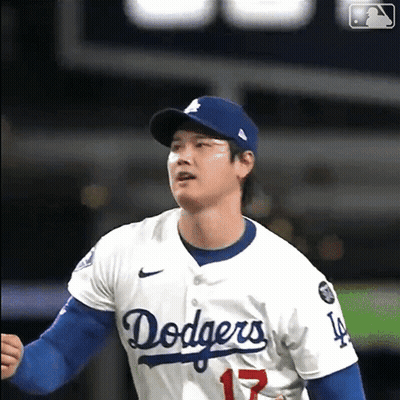 A Man Wearing A Dodgers Jersey With The Number 17 GIF
