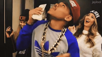 A Man Wearing A Dope Hat Is Holding A Bunch Of Money In His Hand GIF