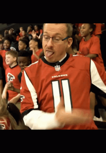 A Man Wearing A Falcons Jersey With The Number 11 On It GIF