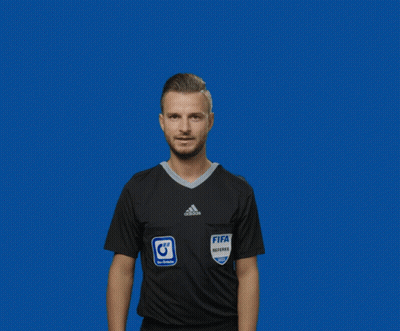 A Man Wearing A Fifa Referee Jersey Holds Up His Fingers GIF