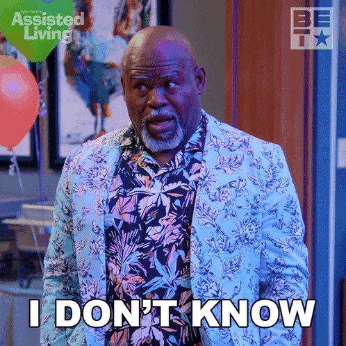 A Man Wearing A Floral Shirt And A Blue Jacket Says I Don 'T Know GIF